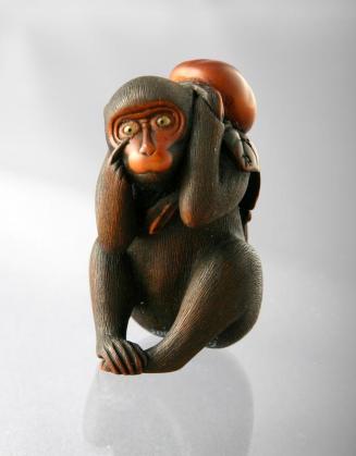 Netsuke of a Monkey Holding a Branch with Persimmons on his Back