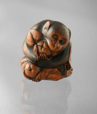 Netsuke of a Monkey Biting into a Persimmon