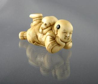 Ivory Netsuke of a Chinese Boy with a Puppy