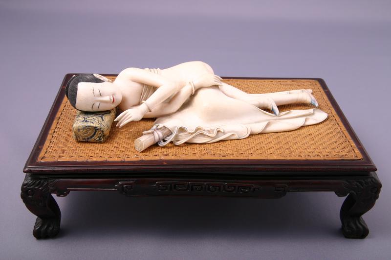 Reclining Nude Woman on a Miniature Bed