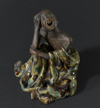 Figurine of Seated Man