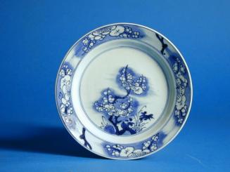 Plate with underglaze blue design of plum tree and bamboo sprays