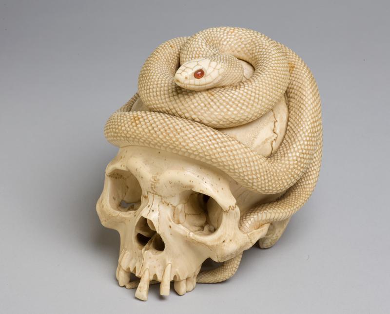 Weight in the form of a Human Cranium with a Snake