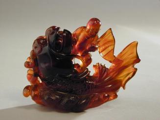 Amber Figure of a Boy on a Mythical Dragon-Headed Carp