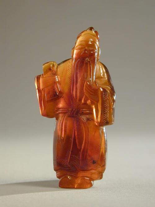 Small Amber Carving of An Immortal
