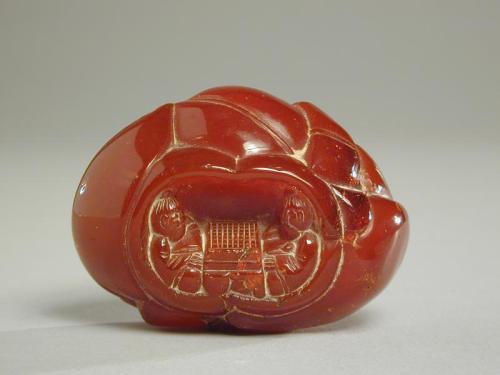 Amber Carving of a Lotus Bud with Go Players Inside