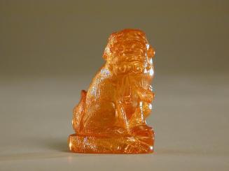 Amber Figurine of Fu Dog with Cape and Ball