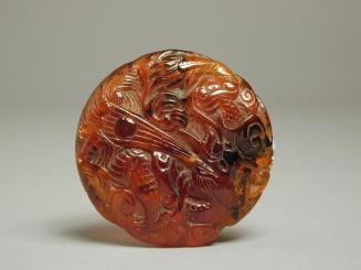 Disc Carved with Dragons, Fish and Waves