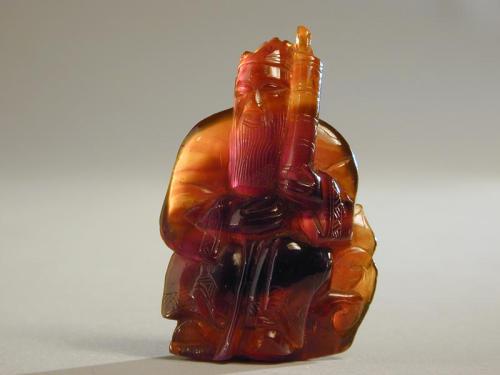 Amber Carving of Seated Immortal