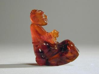 Amber Carving of a Seated Immortal