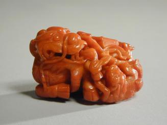 Amber Carving of a Qilin and Its Young with a Stack of Books
