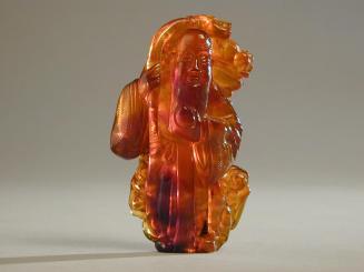 Amber Carving of Shou Lao with a Peach and a Ruyi Sceptre
