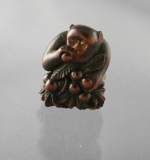 Netsuke of a Monkey eating from a Branch of Persimmons