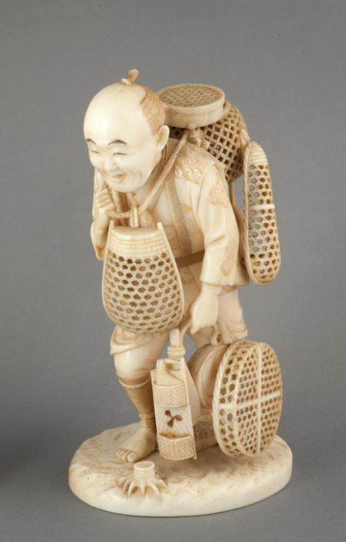 Figure of a Man with Baskets