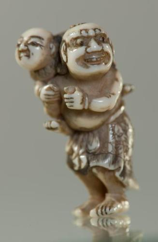 Netsuke of a Foreigner with a Child