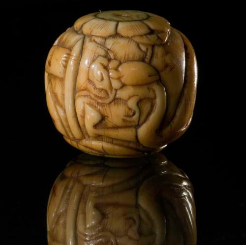 Large Ivory Bead with a Dragon and Flower Design