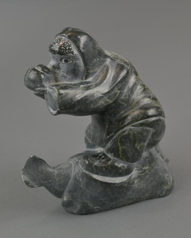 One-Handed Inuk Eating Seal
