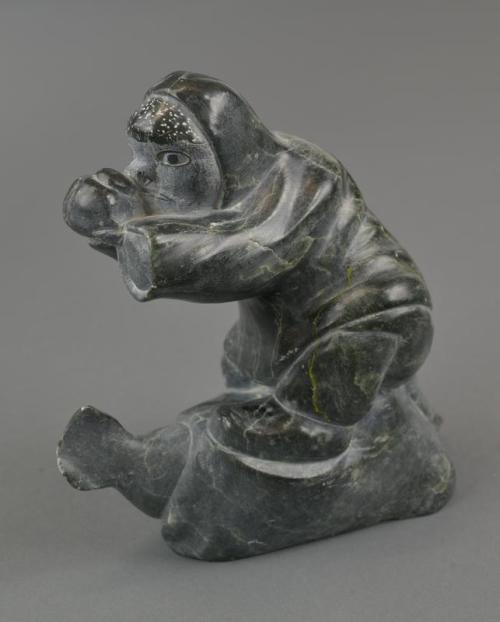 One-Handed Inuk Eating Seal