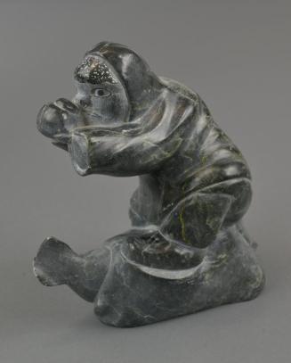 One-Handed Inuk Eating Seal