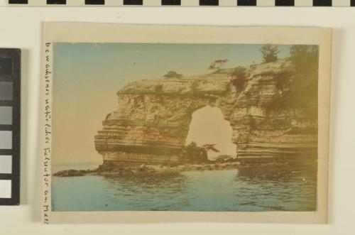 Untitled (stone arch in sea)