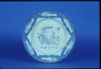 Dish with figure in landscape