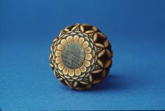 Netsuke of Openwork Cushion with chrysanthemum design