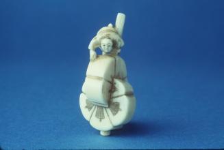 Netsuke depicting a Man and a Rice Mill
