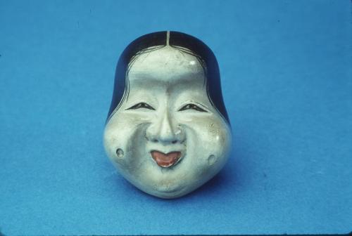 Netsuke in the form of a Kyogen Mask of Okame