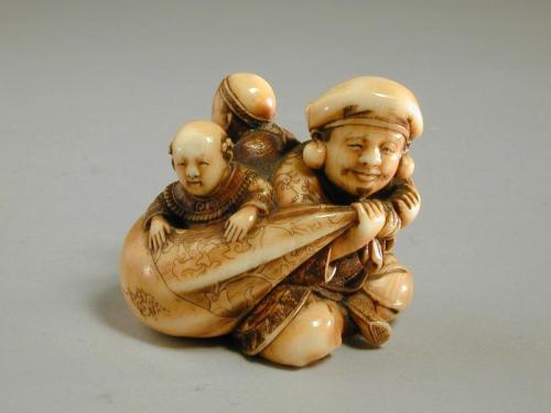 Netsuke depicting Daikokuten with Two Children on His Back