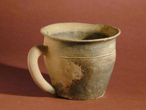 Stoneware Cup with Dip in Lip