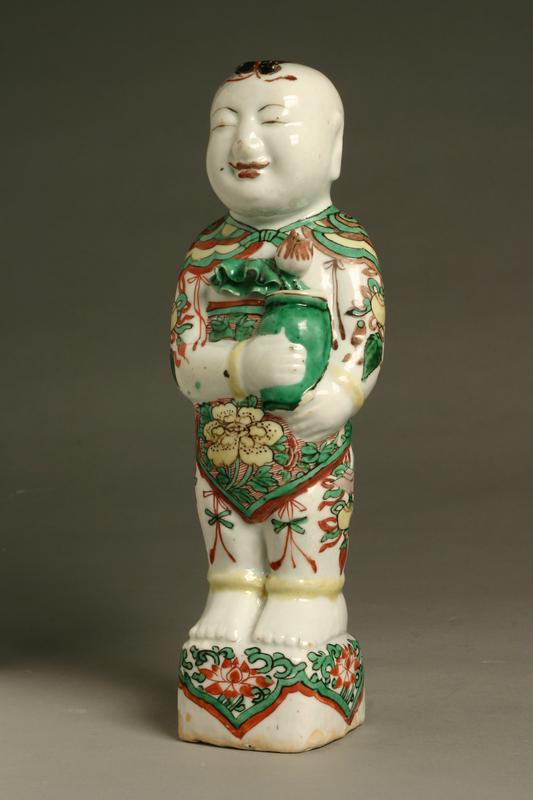 Ceramic Figure of a Boy Holding a Vase