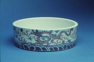 Washer with underglaze blue and red design of three dragons chasing flaming pearls