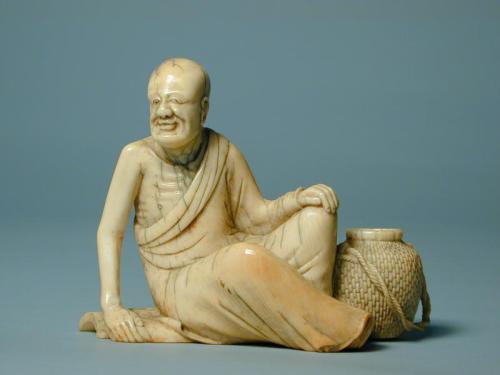 Seated Arhat (Luohan) with wicker basket and book