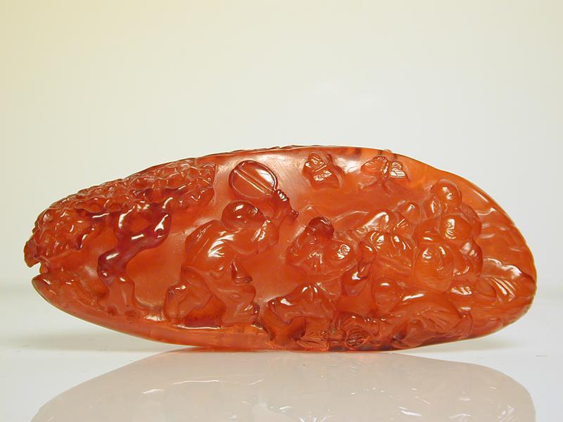 Amber Carving of a Landscape with Pavilion, Bridge & Boys Playing