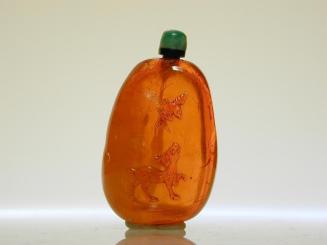 Pebble Form Amber Snuff Bottle with Design of a Deer and of a Bird in Flight