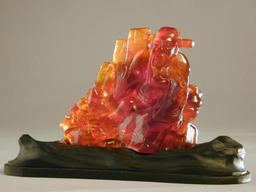 Amber Figurine of an Immortal with Boxes