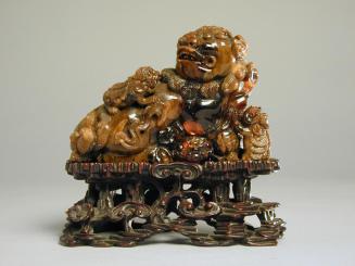 Amber Carving of a Buddhistic Lion and Pups